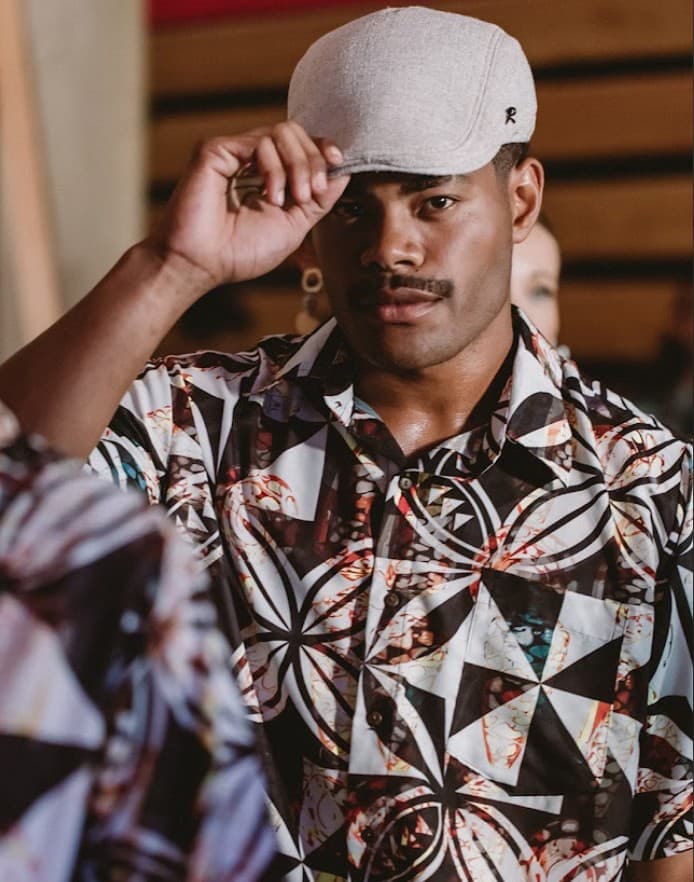 Model presenting a designer garment on the runway