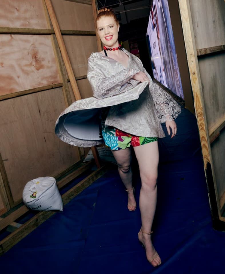Model walking under runway lights